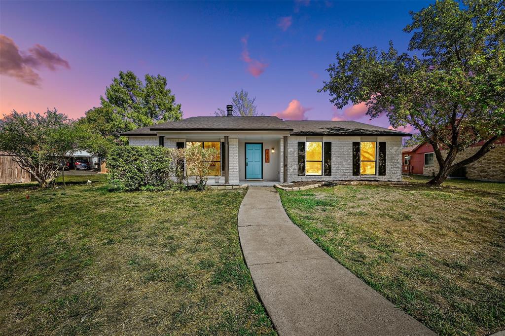 front view of a house with a yard