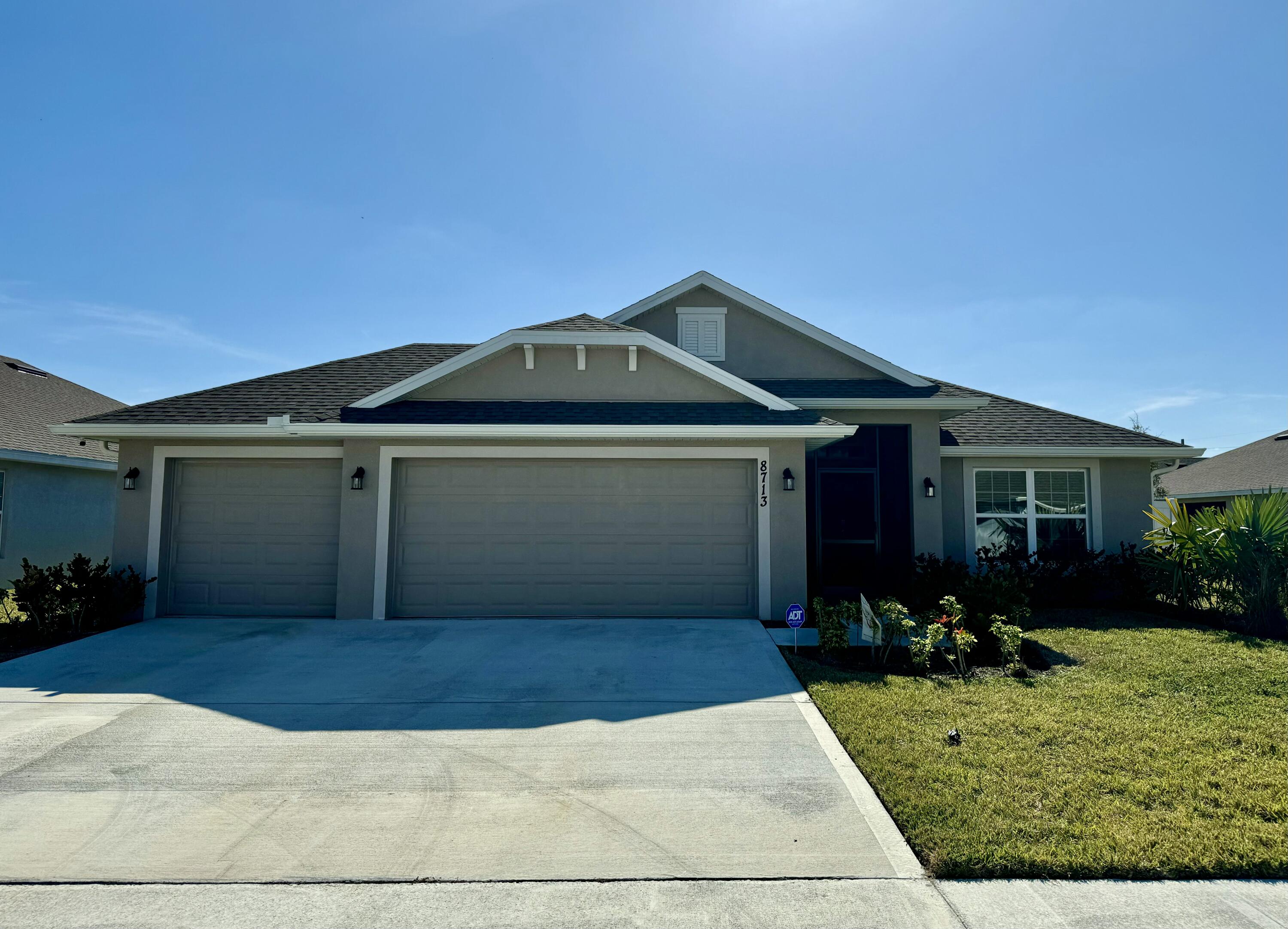 a front view of house with yard outdoor seating and barbeque oven