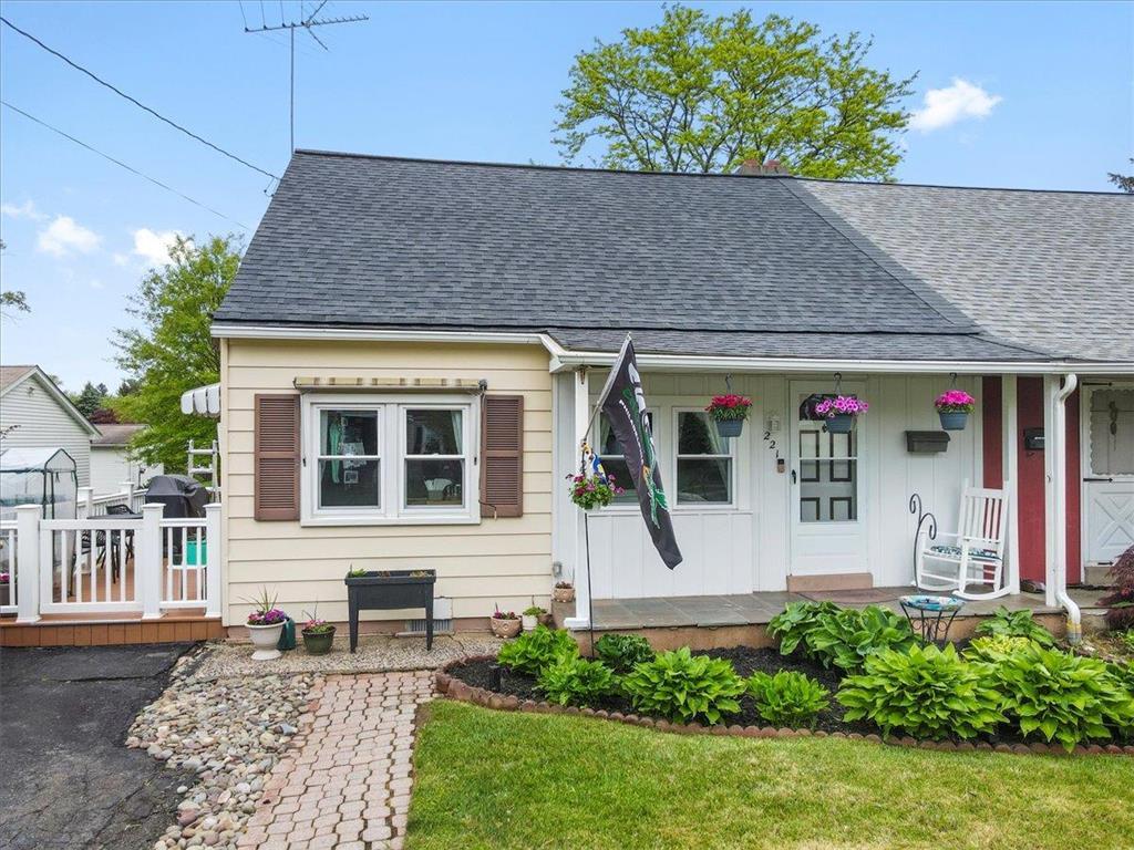 a front view of a house with garden