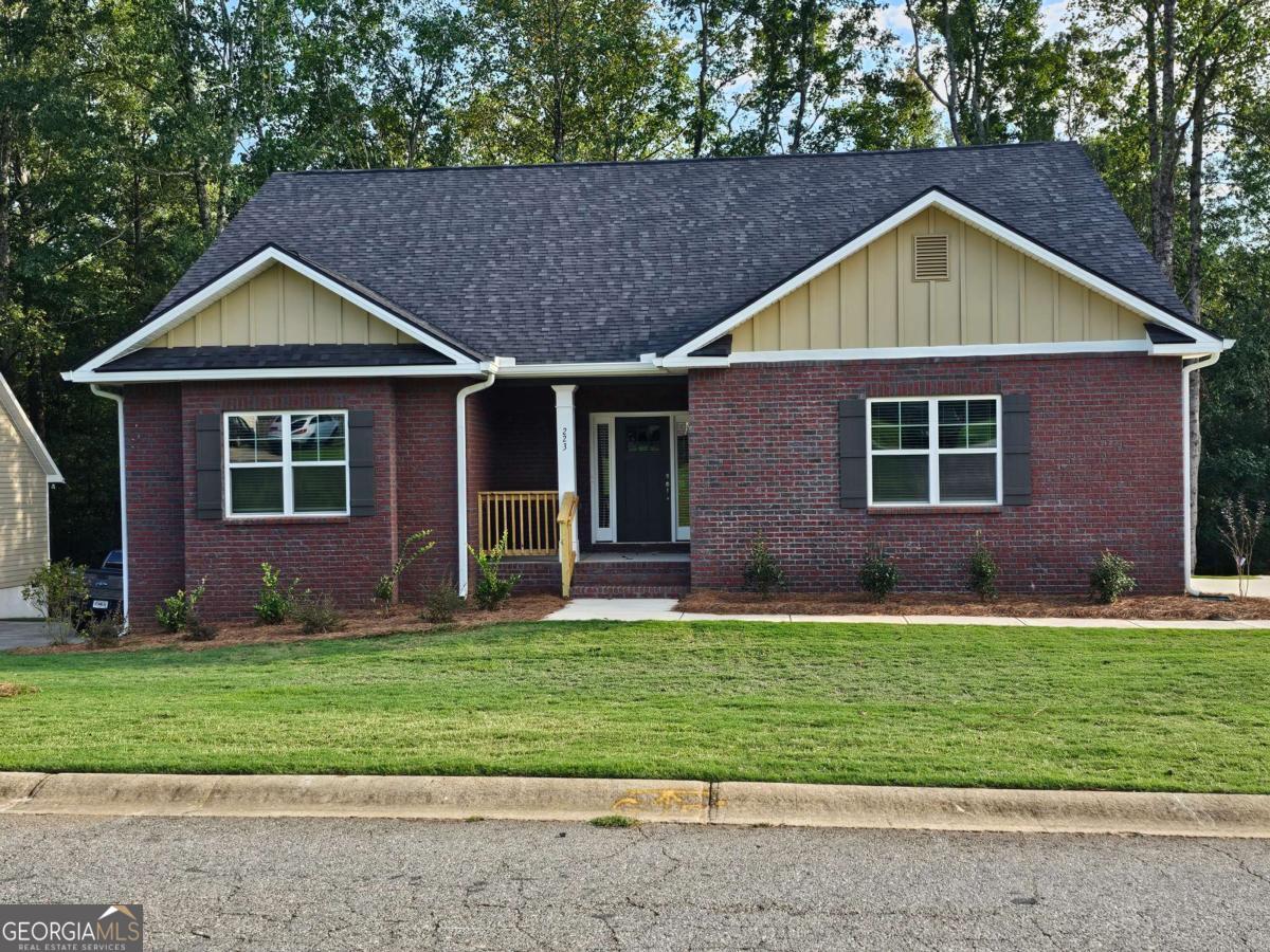 a front view of a house with a yard