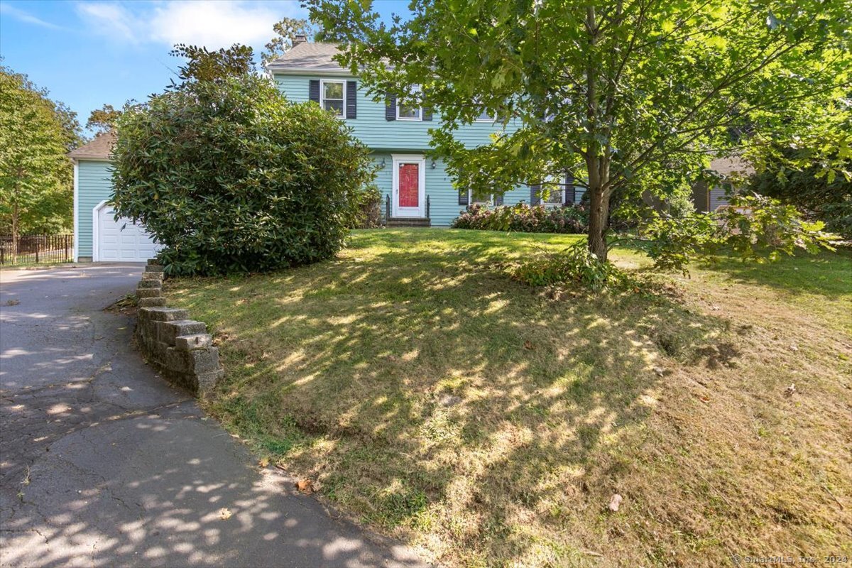 a view of a house with a tree