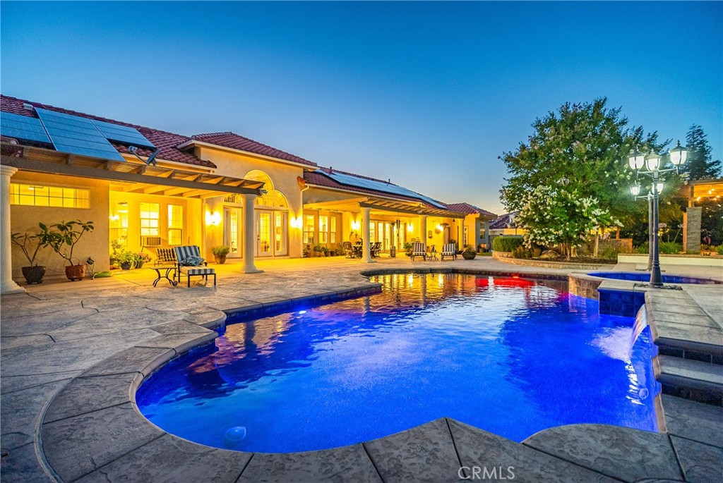 a view of swimming pool with chairs