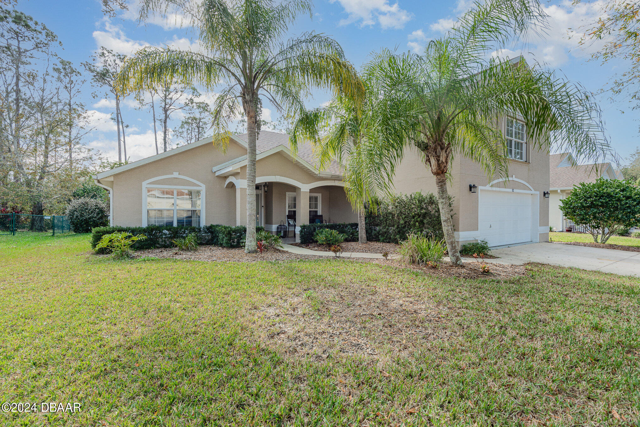 a front view of house with yard and entertaining space