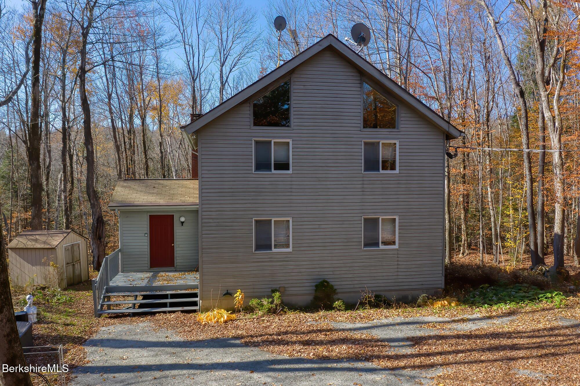 a view of the house with large windows