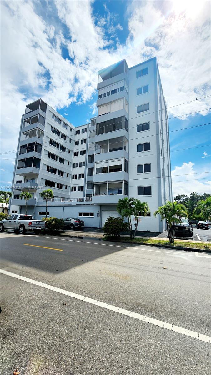 a tall building sitting next to a road