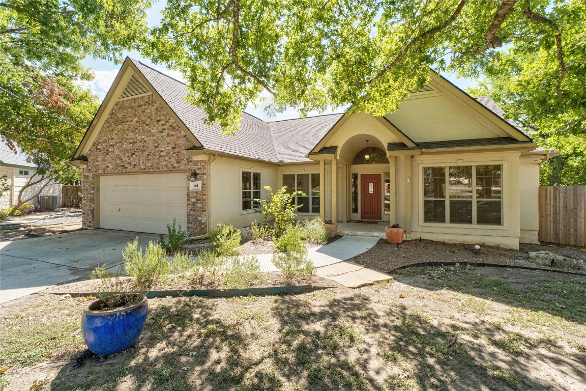 a front view of a house with a yard and porch