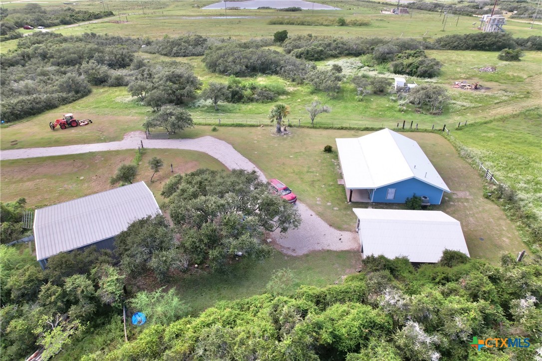 an aerial view of house with yard swimming pool and outdoor seating