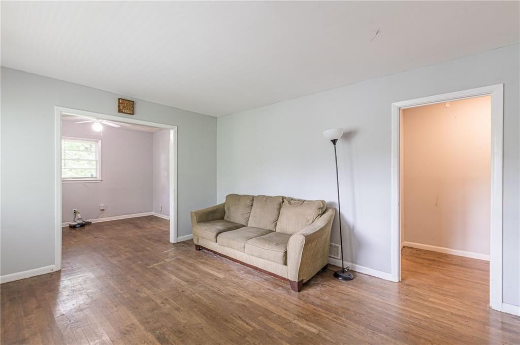 a living room with a couch and a window