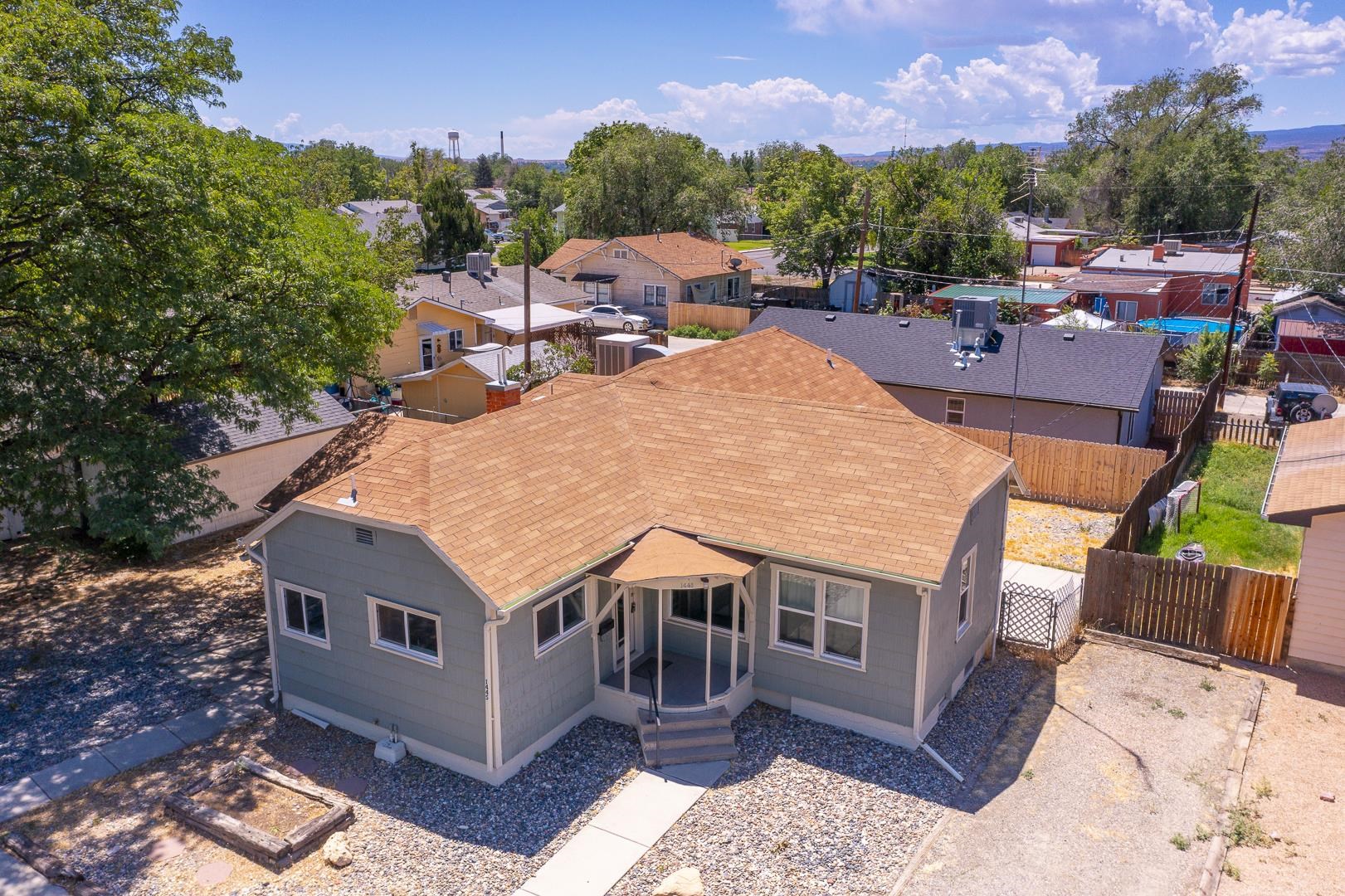 an aerial view of a house with a yard