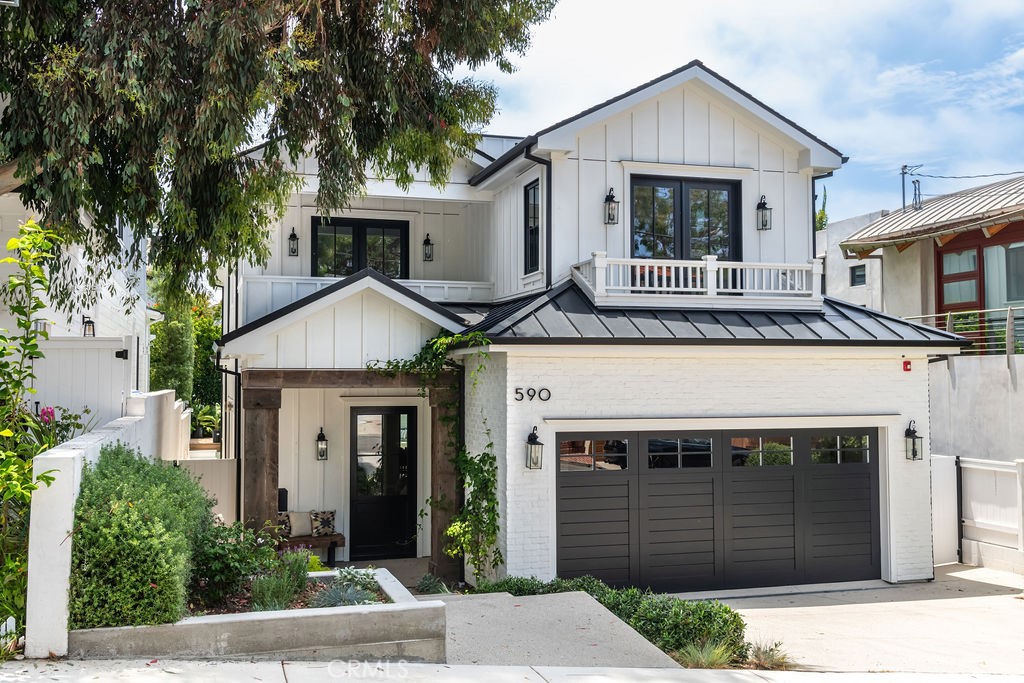 a front view of a house with a garage