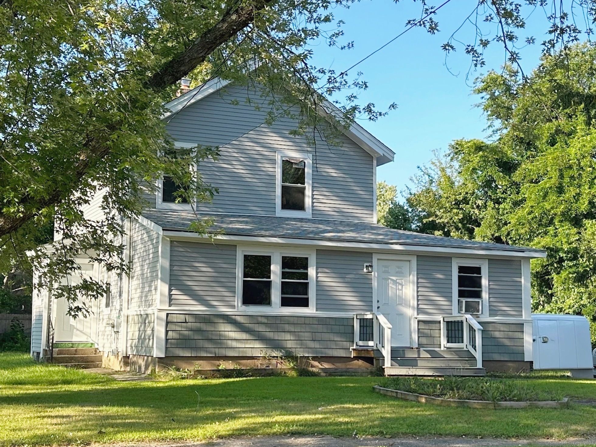 front view of a house with a yard