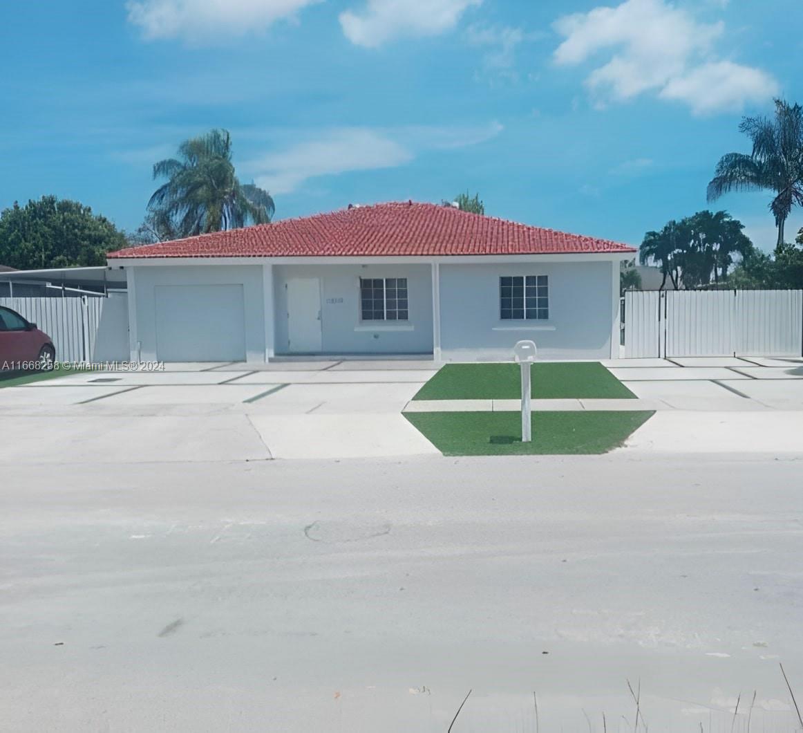 a house with yard in front of it