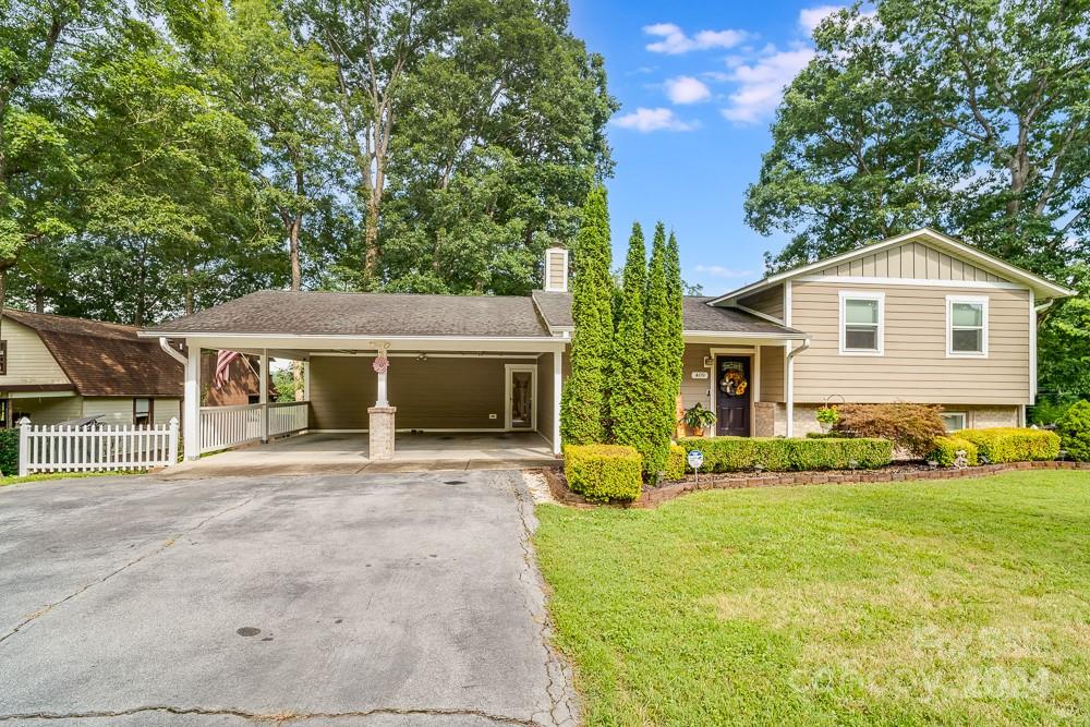 a front view of house with yard and green space