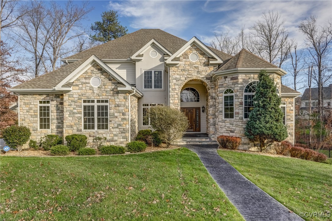 front view of a house with a yard