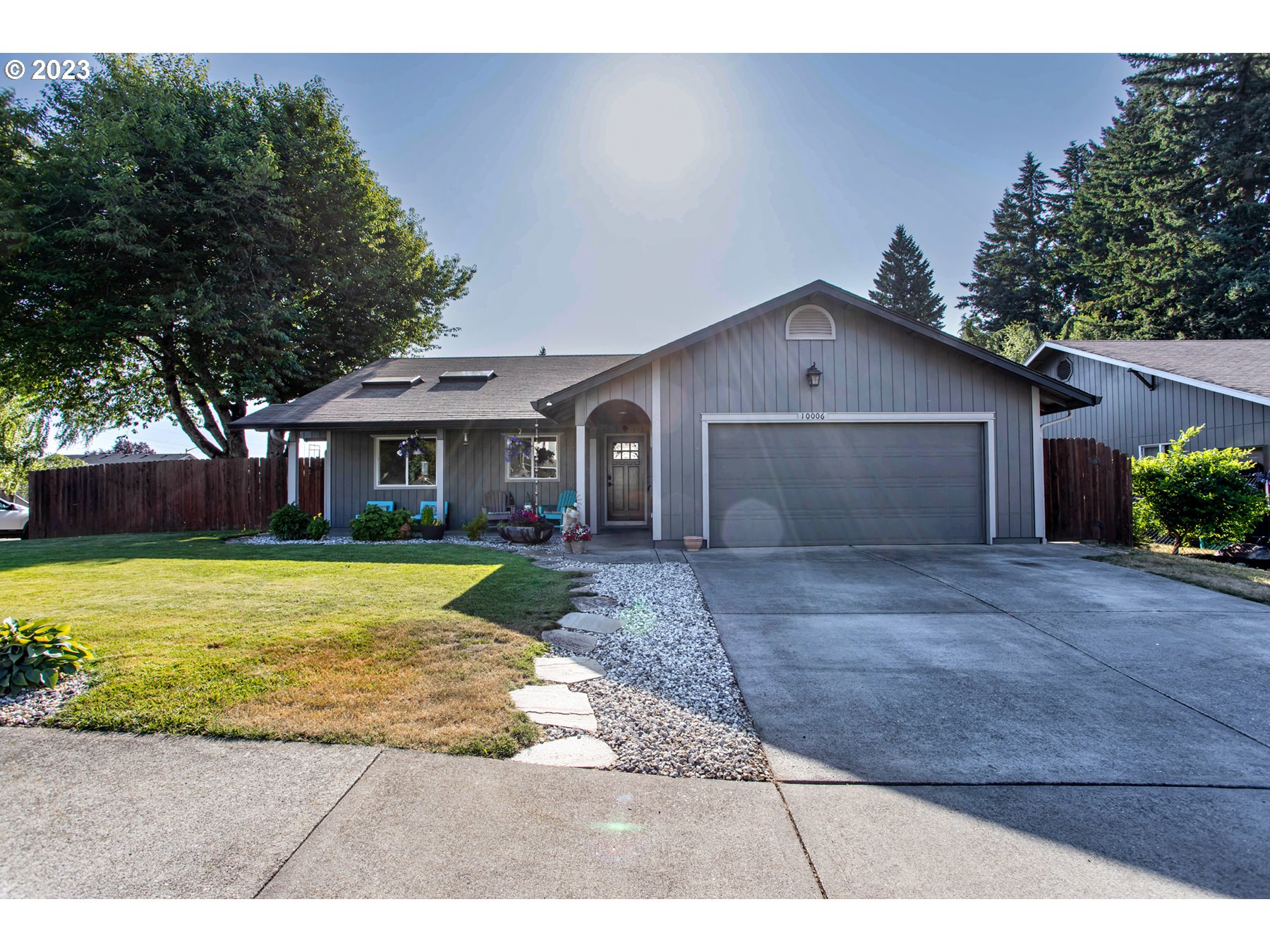 a view of a house with a yard and garage