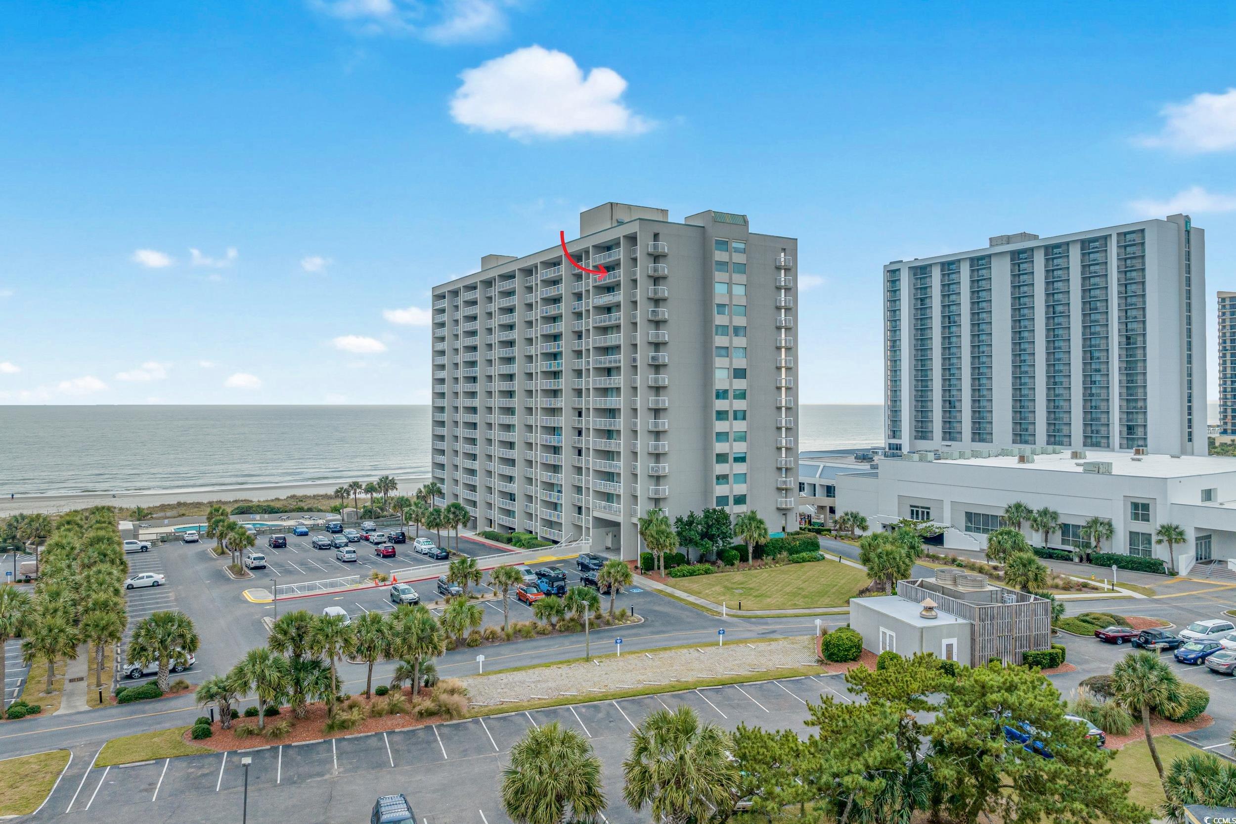 Birds eye view of property with a water view