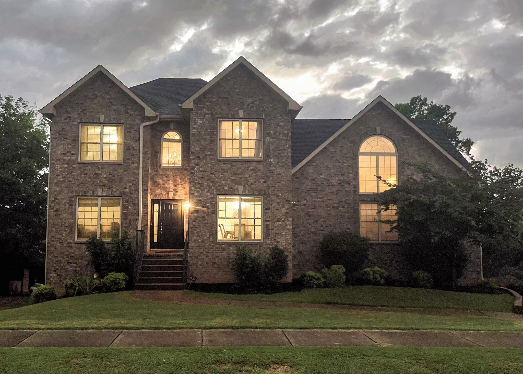 a front view of a house with a yard