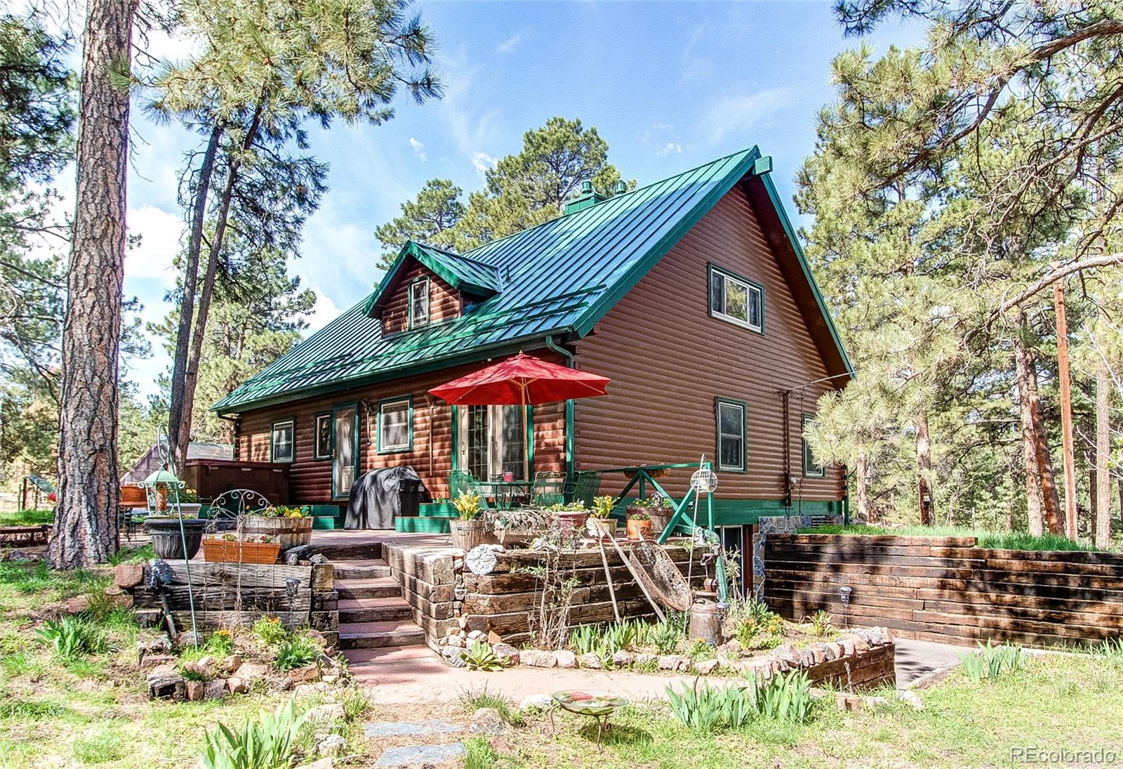 a view of backyard of house with green space and outdoor seating