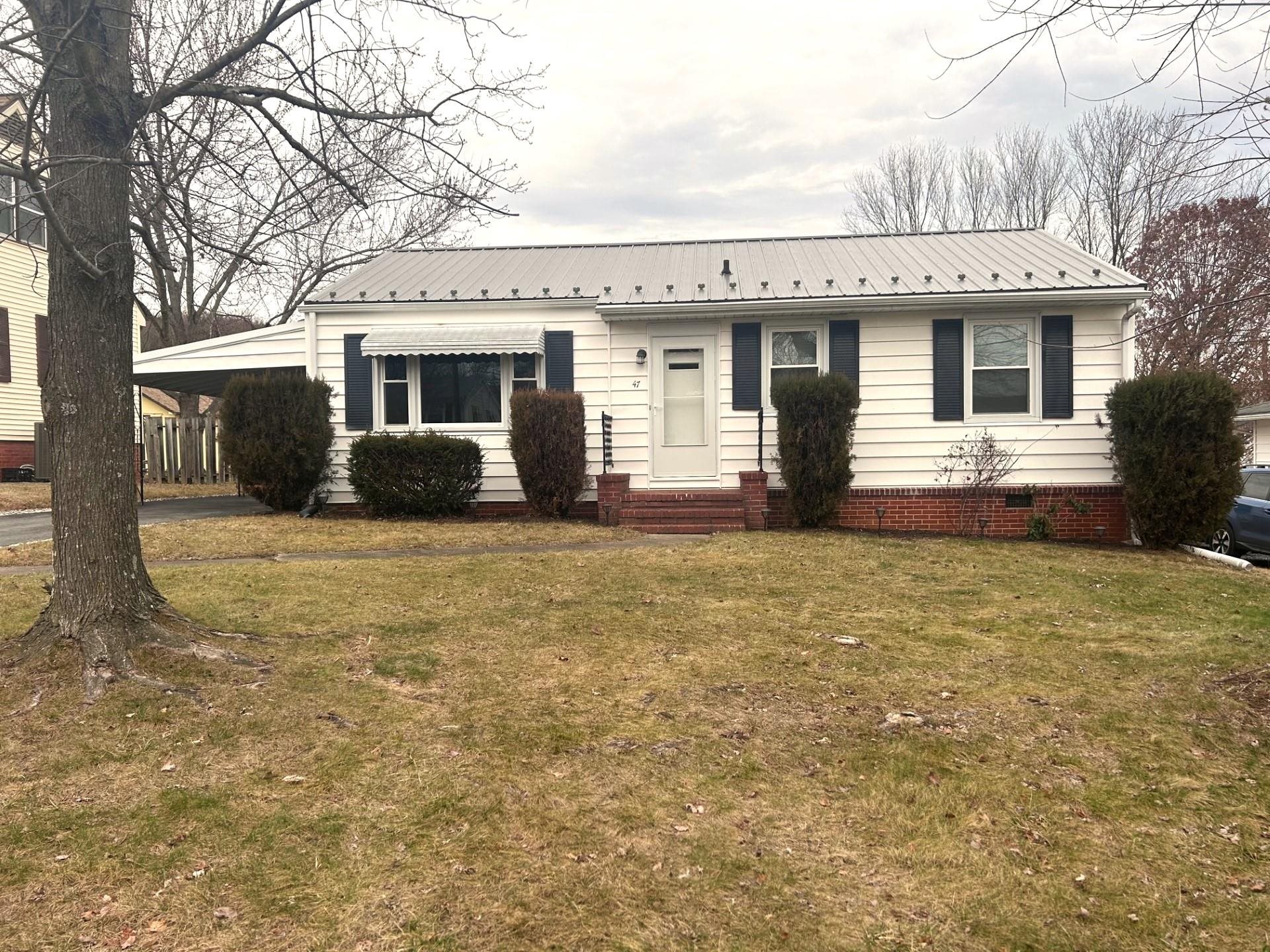 a view of house with yard