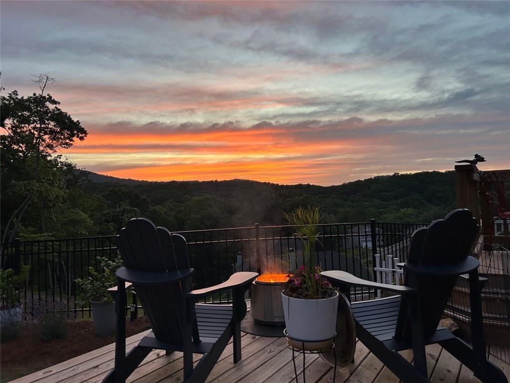 a view of a chairs and table in patio