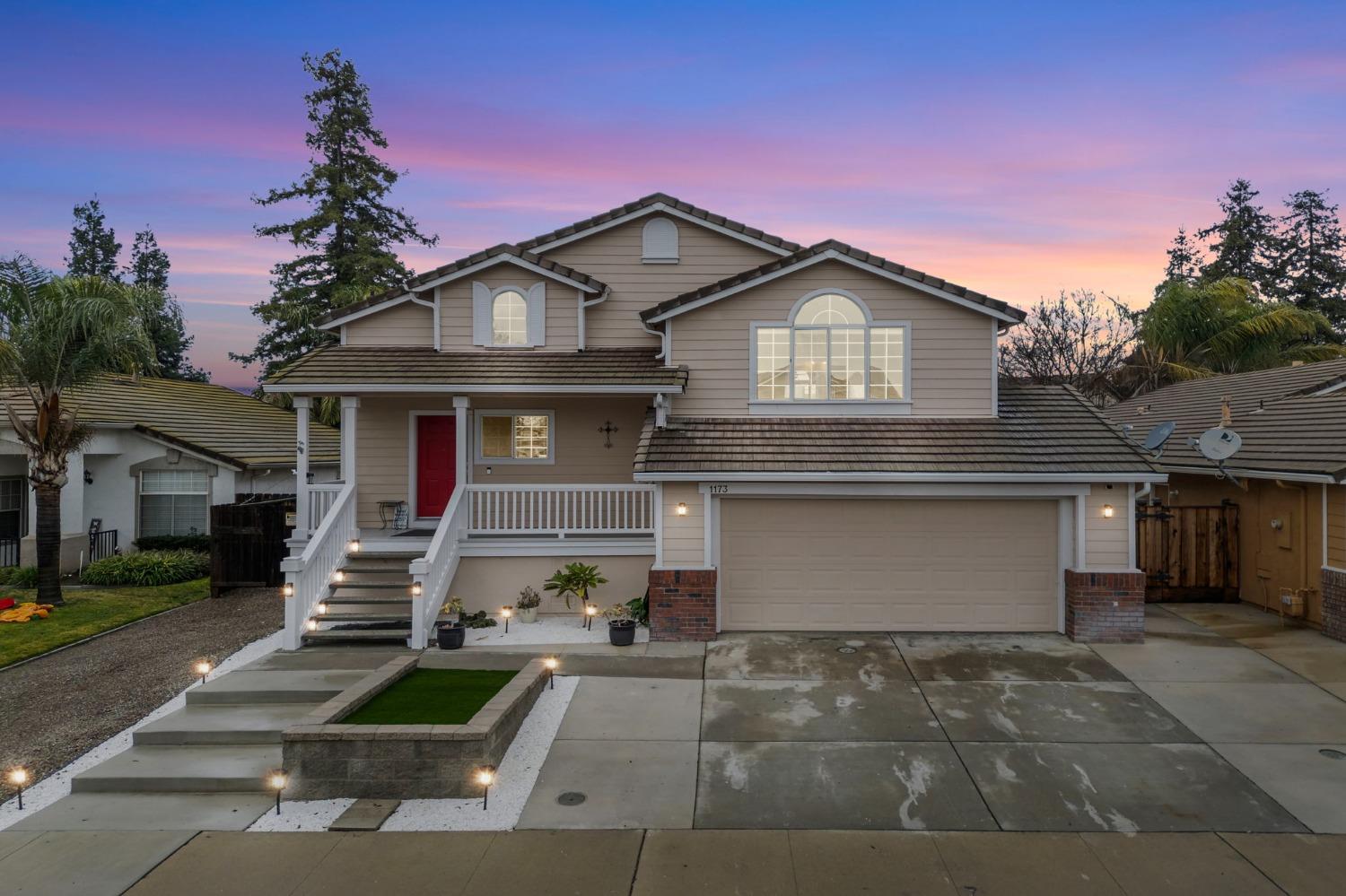 a front view of a house with garage