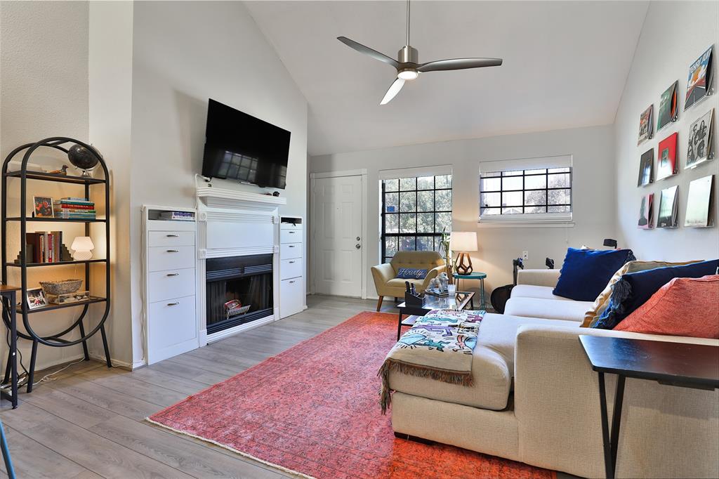 Front door/windows and fireplace in living room