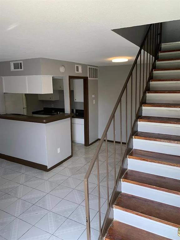 a kitchen with granite countertop a stove and a sink with granite countertops