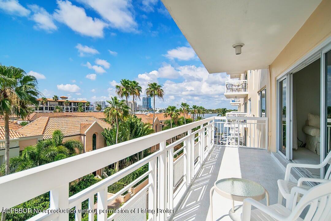 a view of balcony with furniture