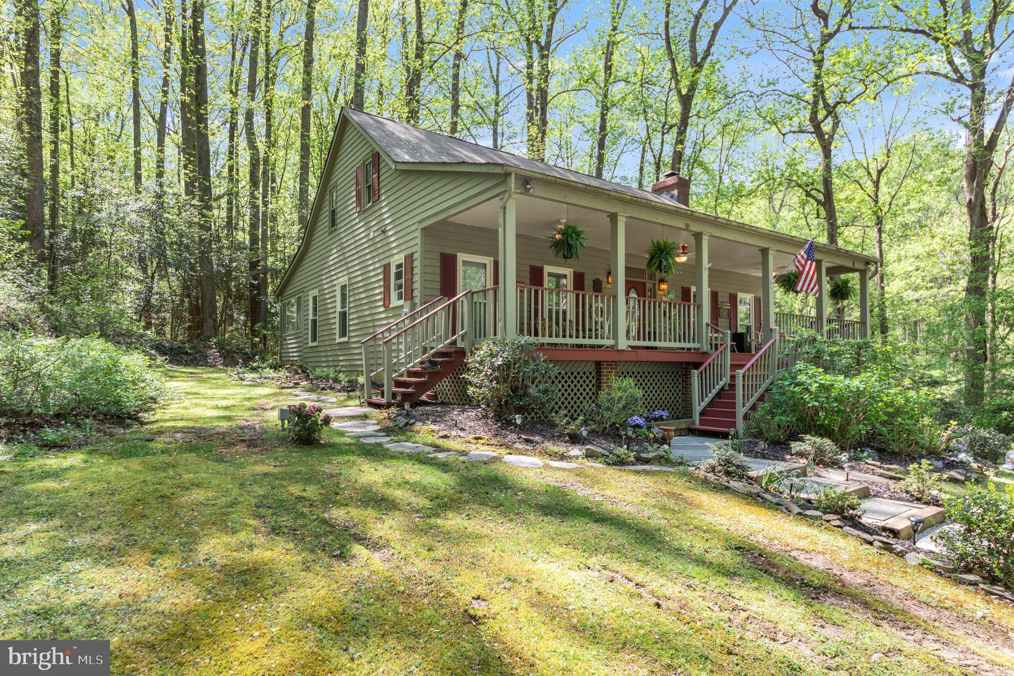 a view of house with backyard