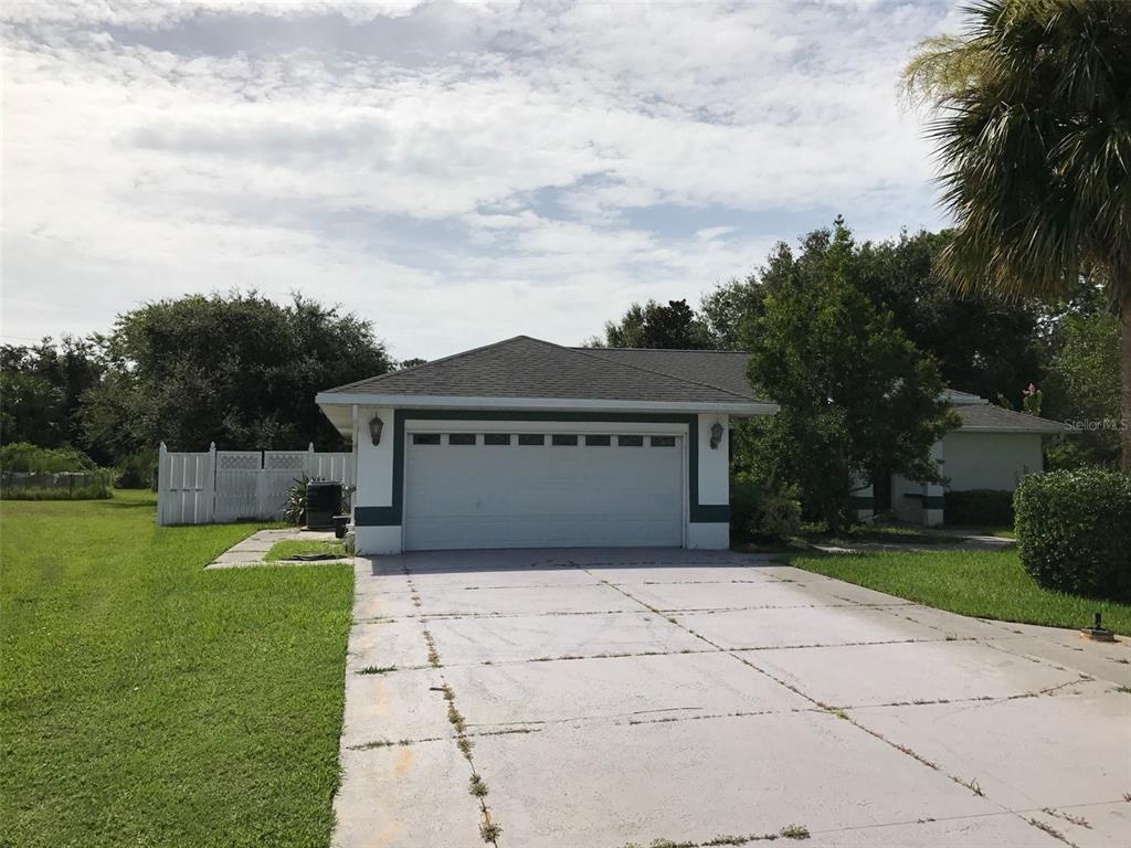 a view of a house with a garden