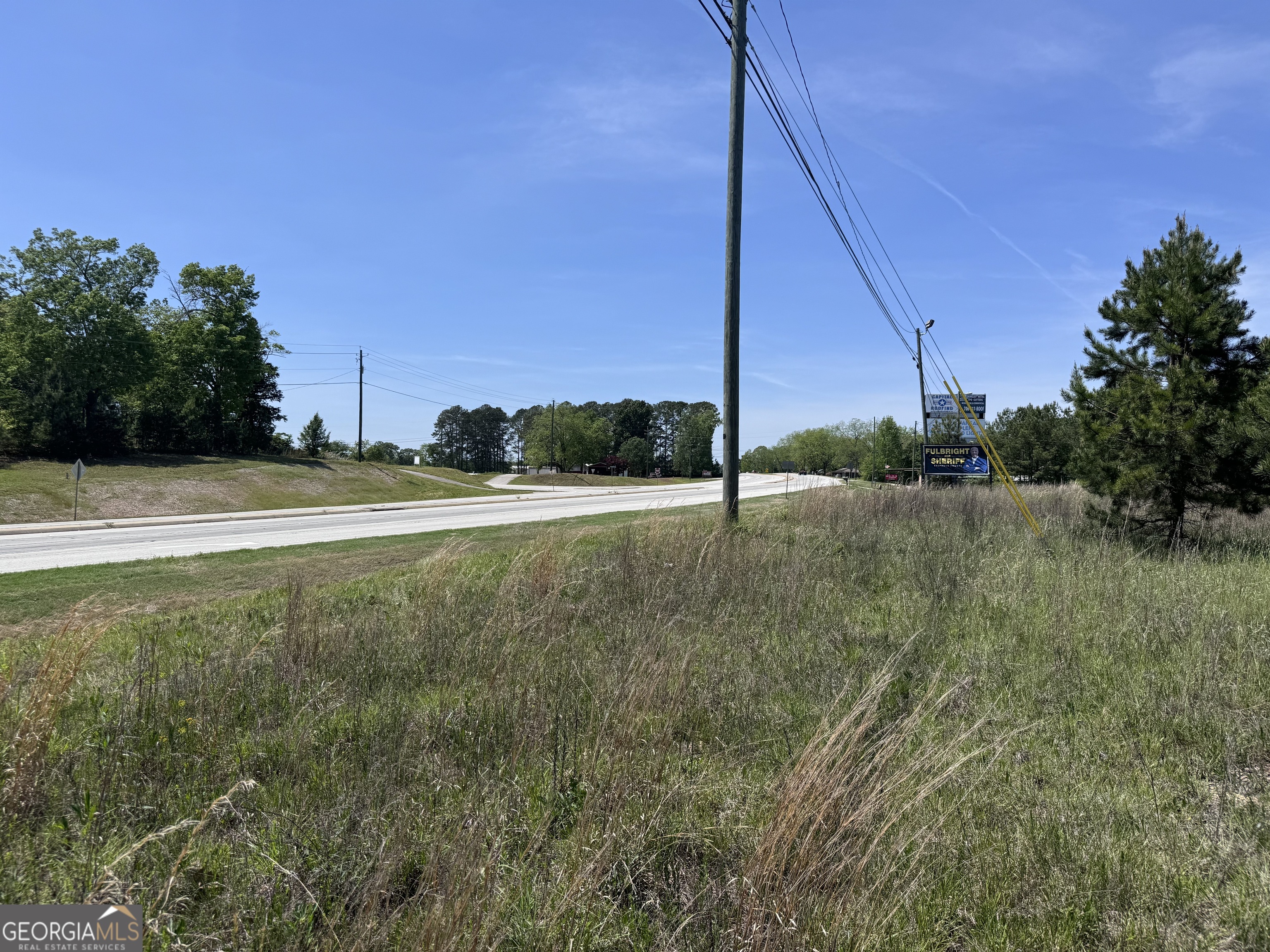 a view of a field with a small yard