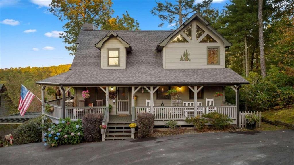 an outdoor view of house along with deck and outdoor seating