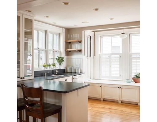 a kitchen with granite countertop a sink and a window