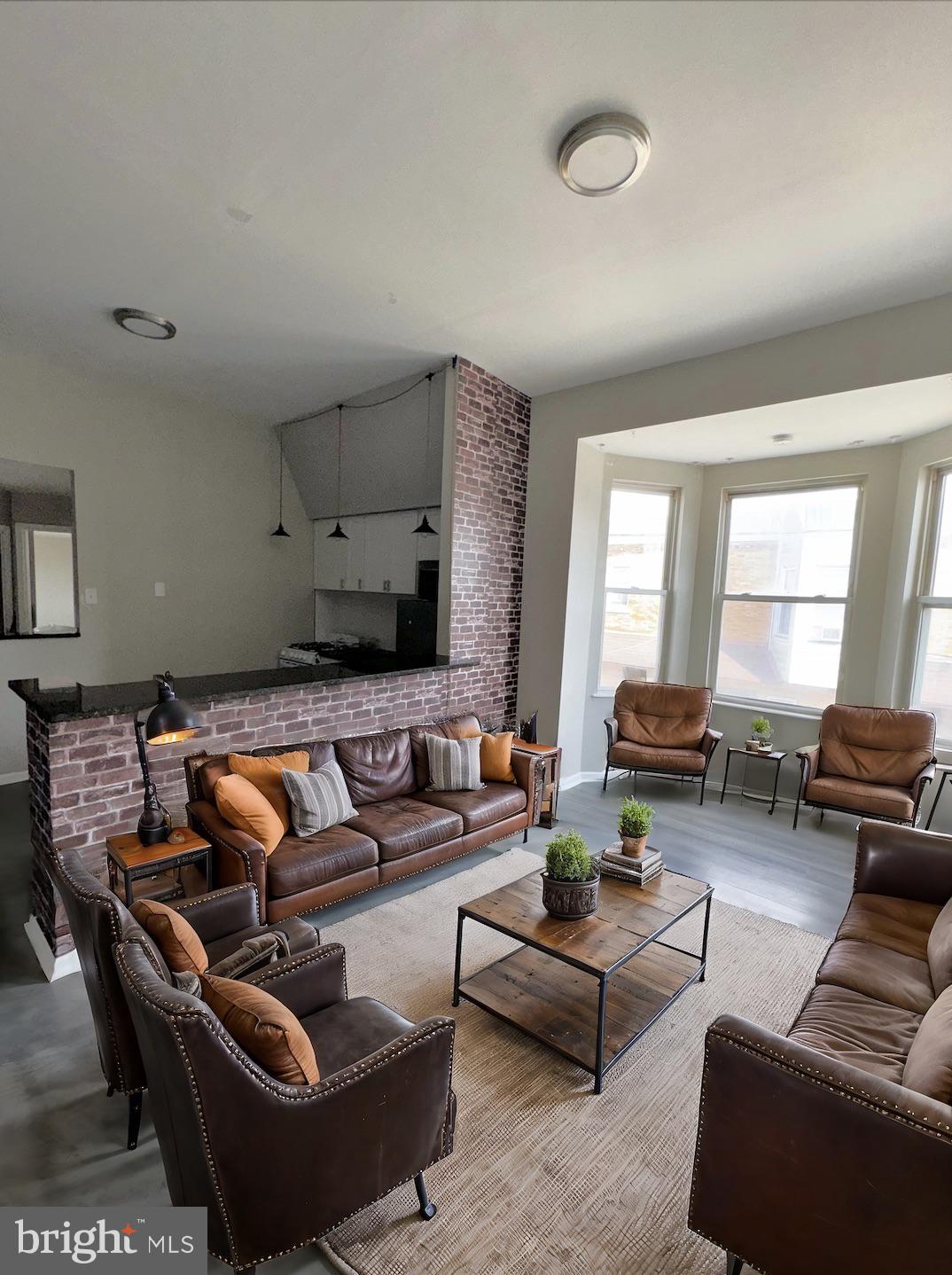 a living room with furniture or couch and a window