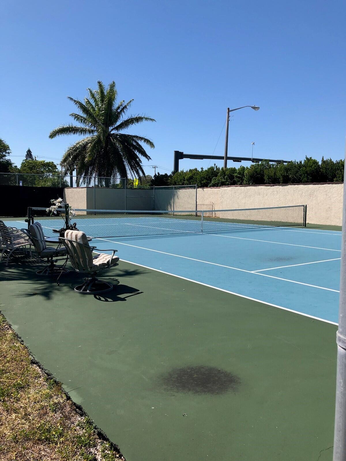 a view of a swimming pool and lounge chair