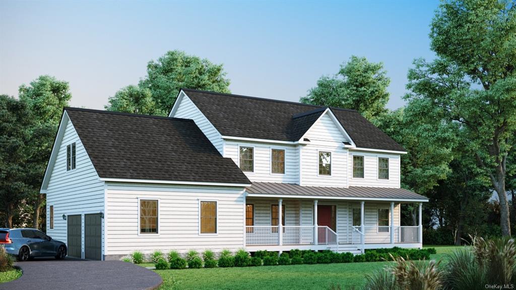 View of front facade featuring a front yard, a porch, and a garage