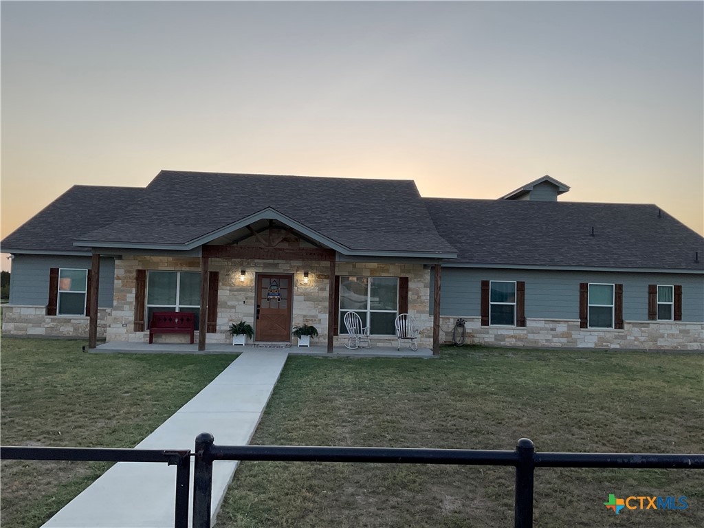 front view of a house with a yard