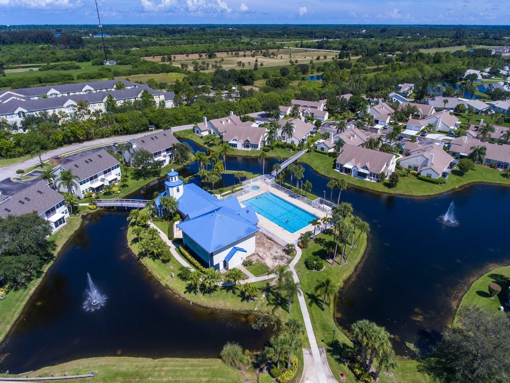 an aerial view of a house with a ocean view