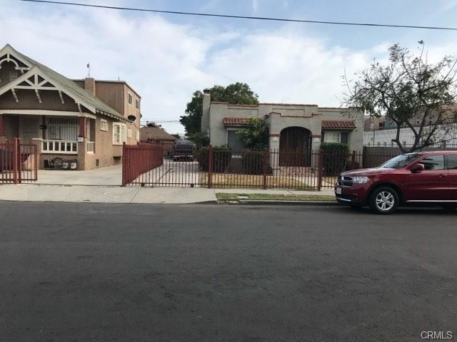 a view of a car park in front of house