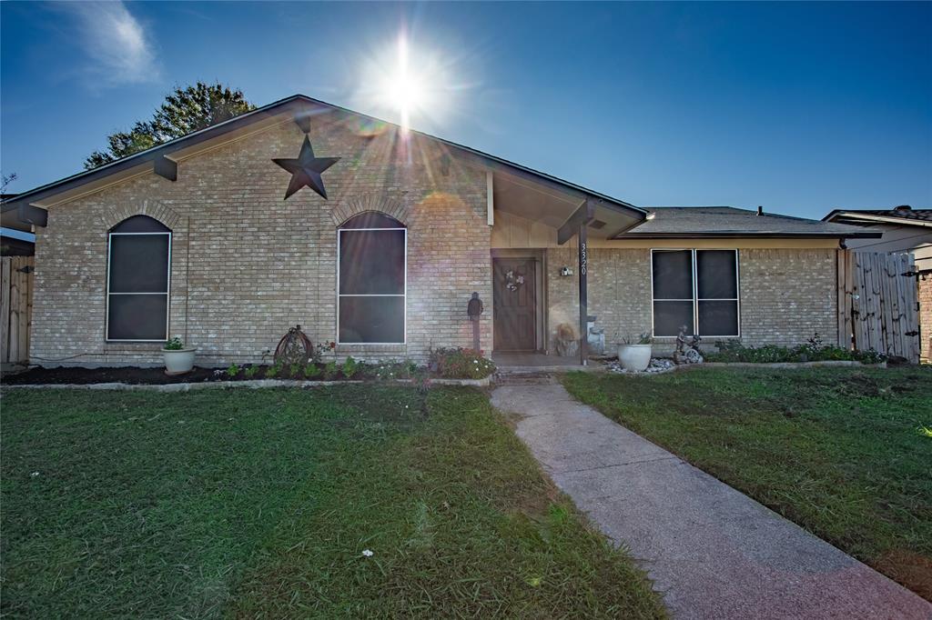 front view of a house with a yard