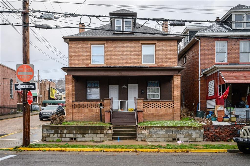 a front view of a house with a porch