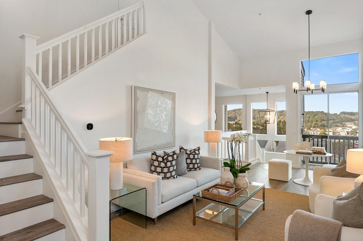 a balcony with furniture and white walls