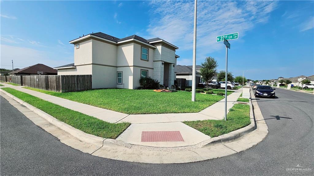 View of property exterior with a yard