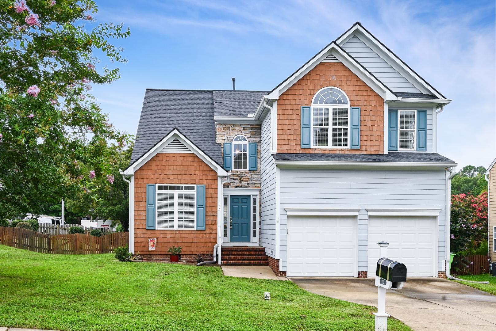 a front view of a house with a yard