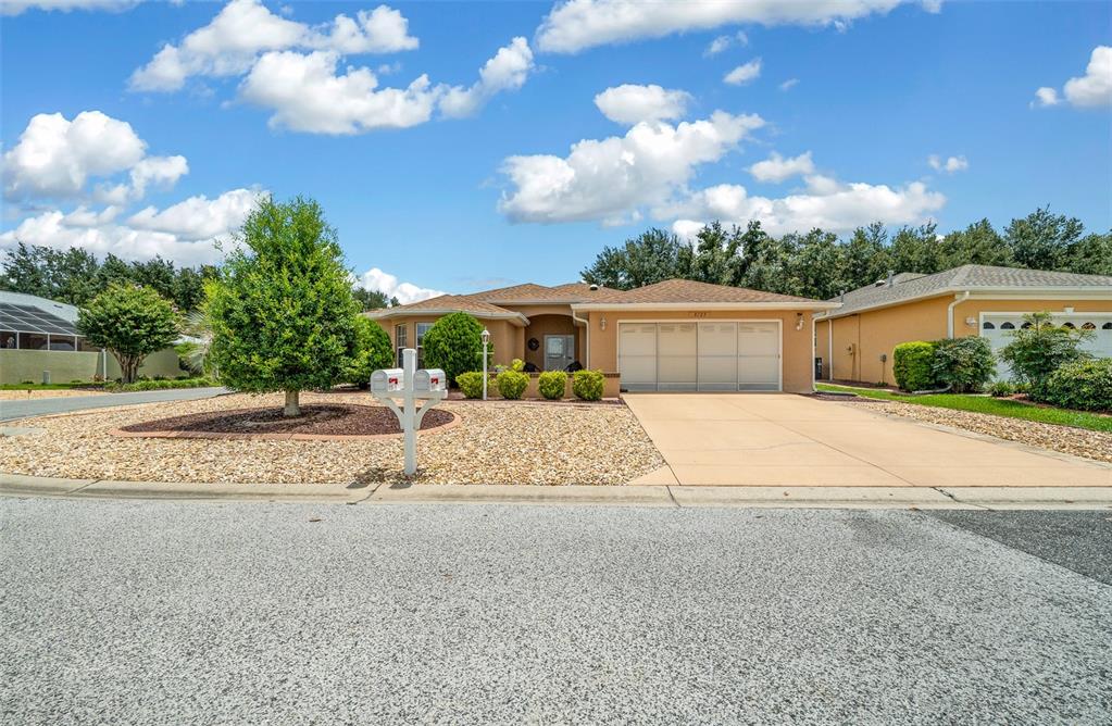 a view of house with outdoor space and tree s