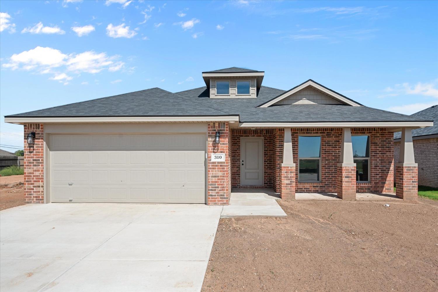 a front view of a house with yard