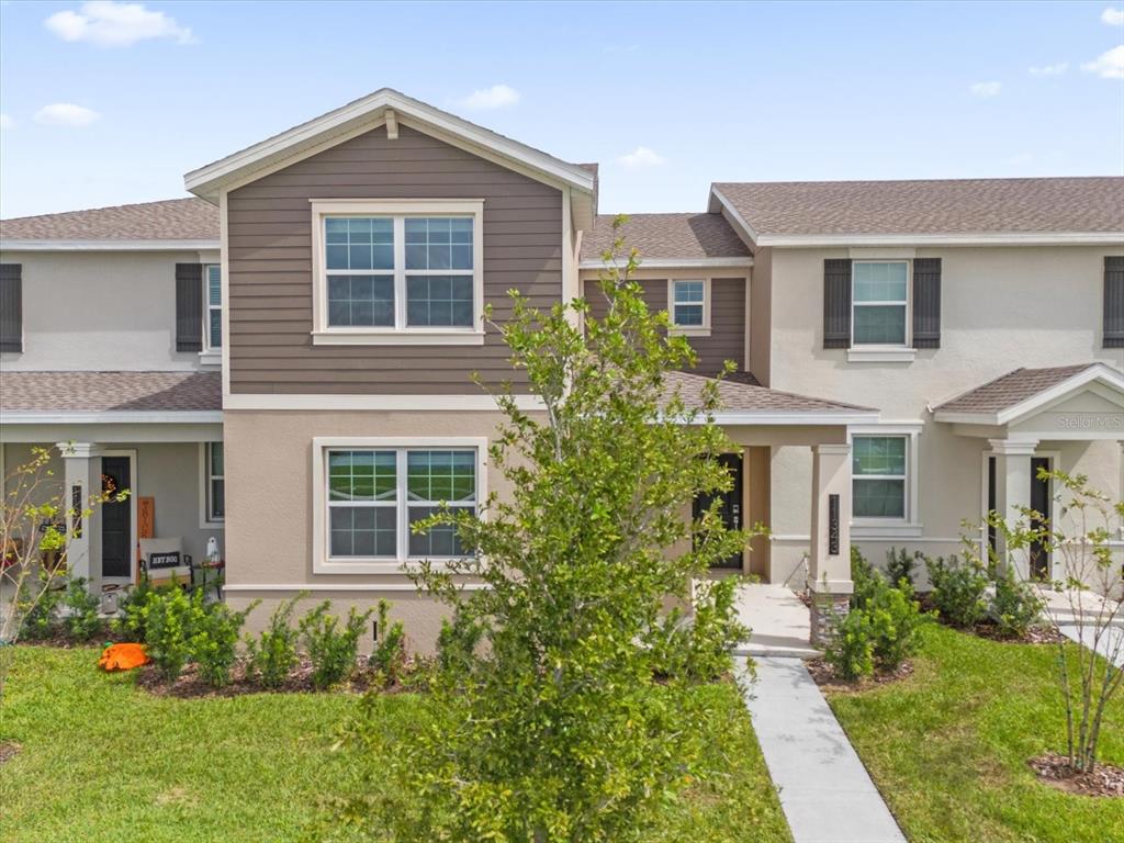 front view of a house with a yard