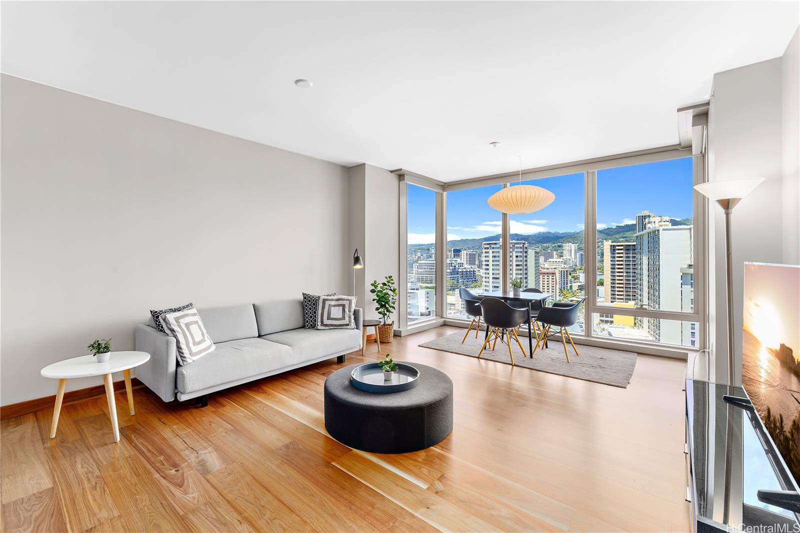 a living room with furniture and a large window