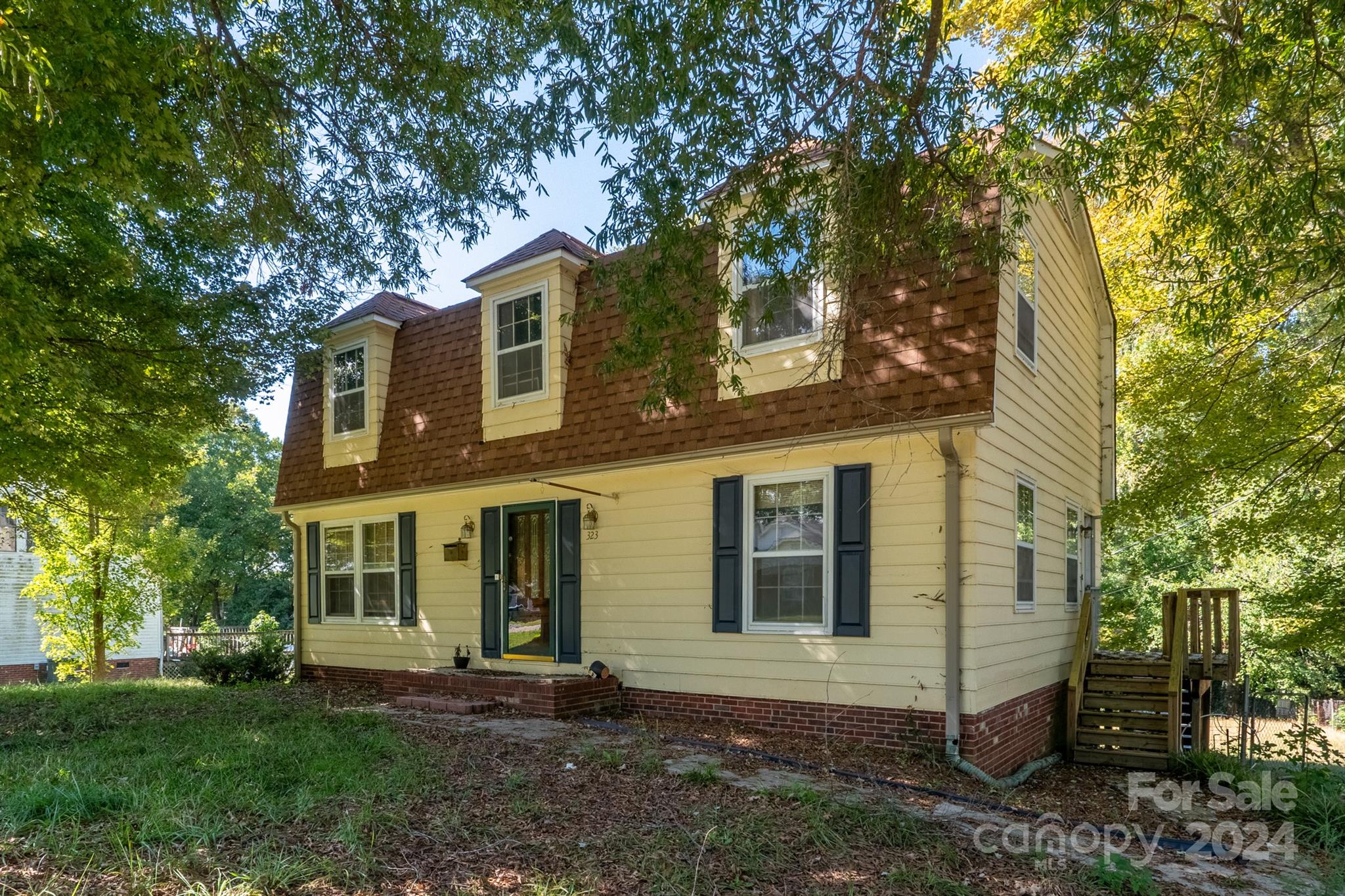 front view of a house with a yard