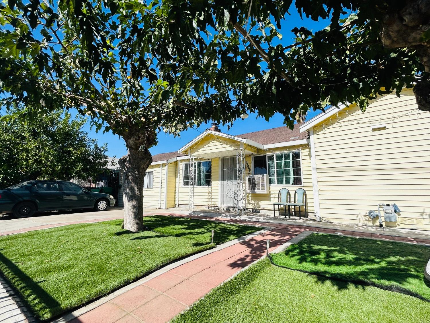 a front view of a house with garden